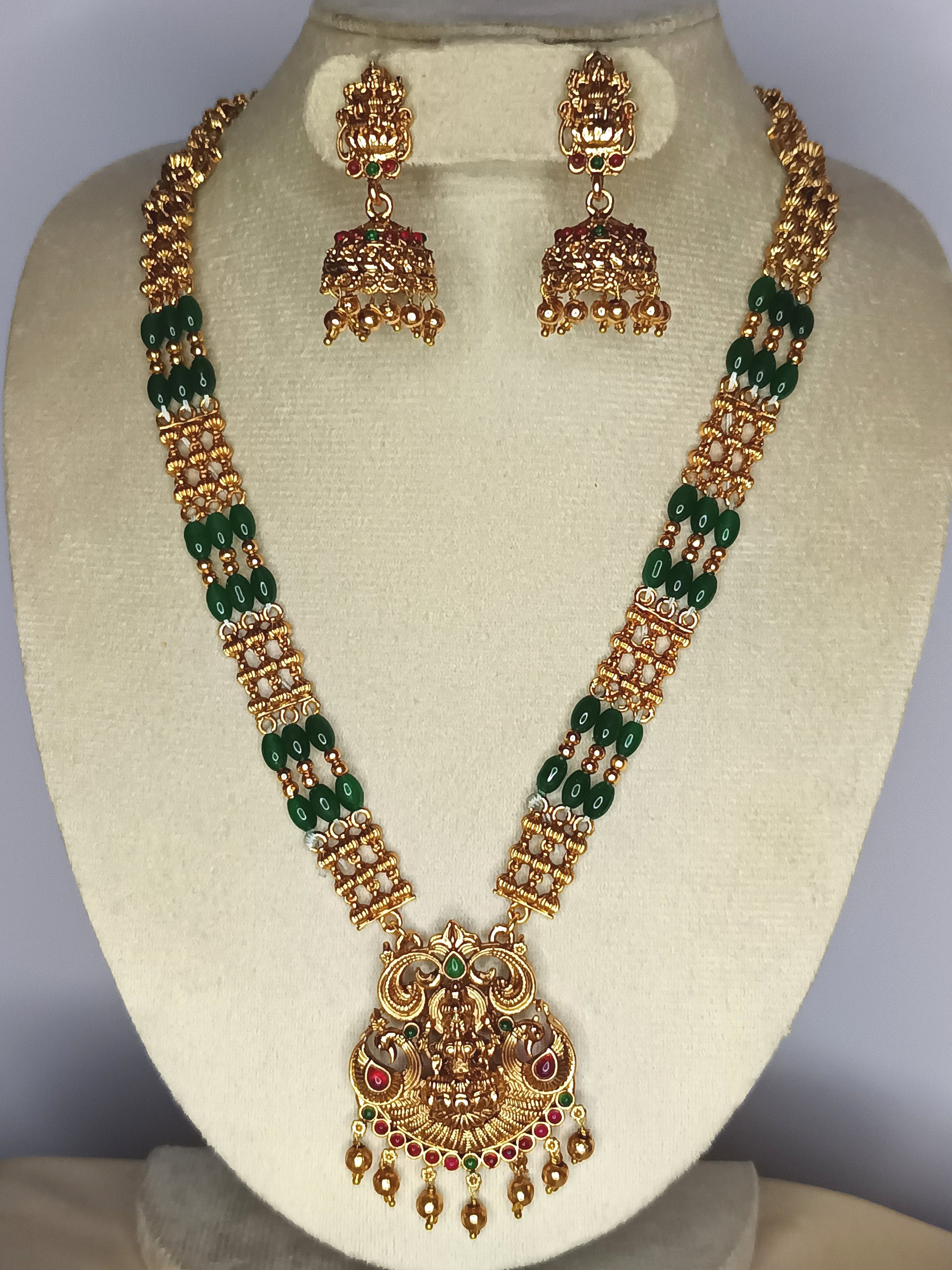 Dazzling Antique lakshmi haram set with emerald beads