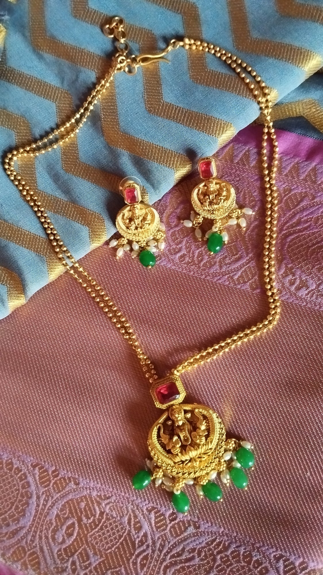 Gold Chain with lakshmi pendent and ruby and Emerlad