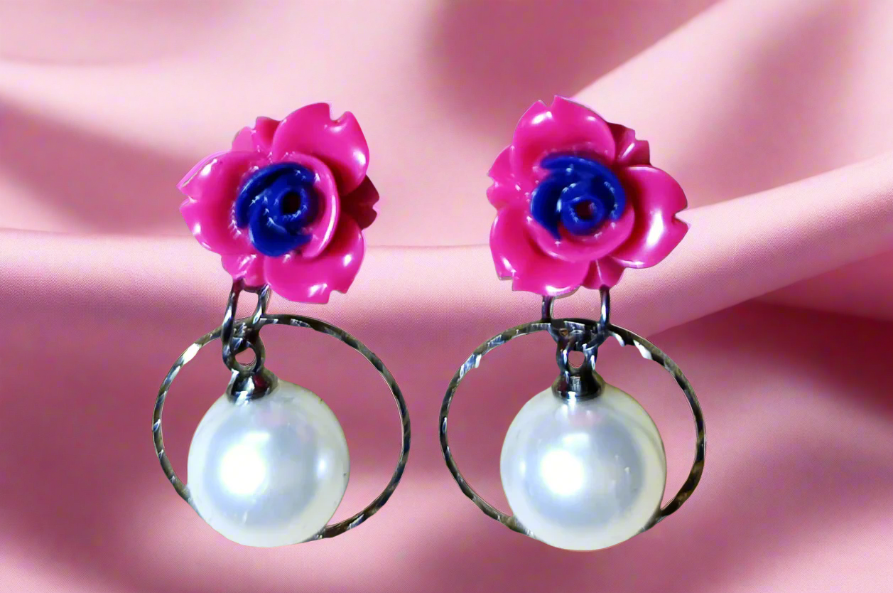 Trendy statement earrings with bold geometric design, fashion-forward jewelry for women. Punnagaidj. Black metal. Classic pearl earrings with black metal setting.must-have jewelry for an elegant look