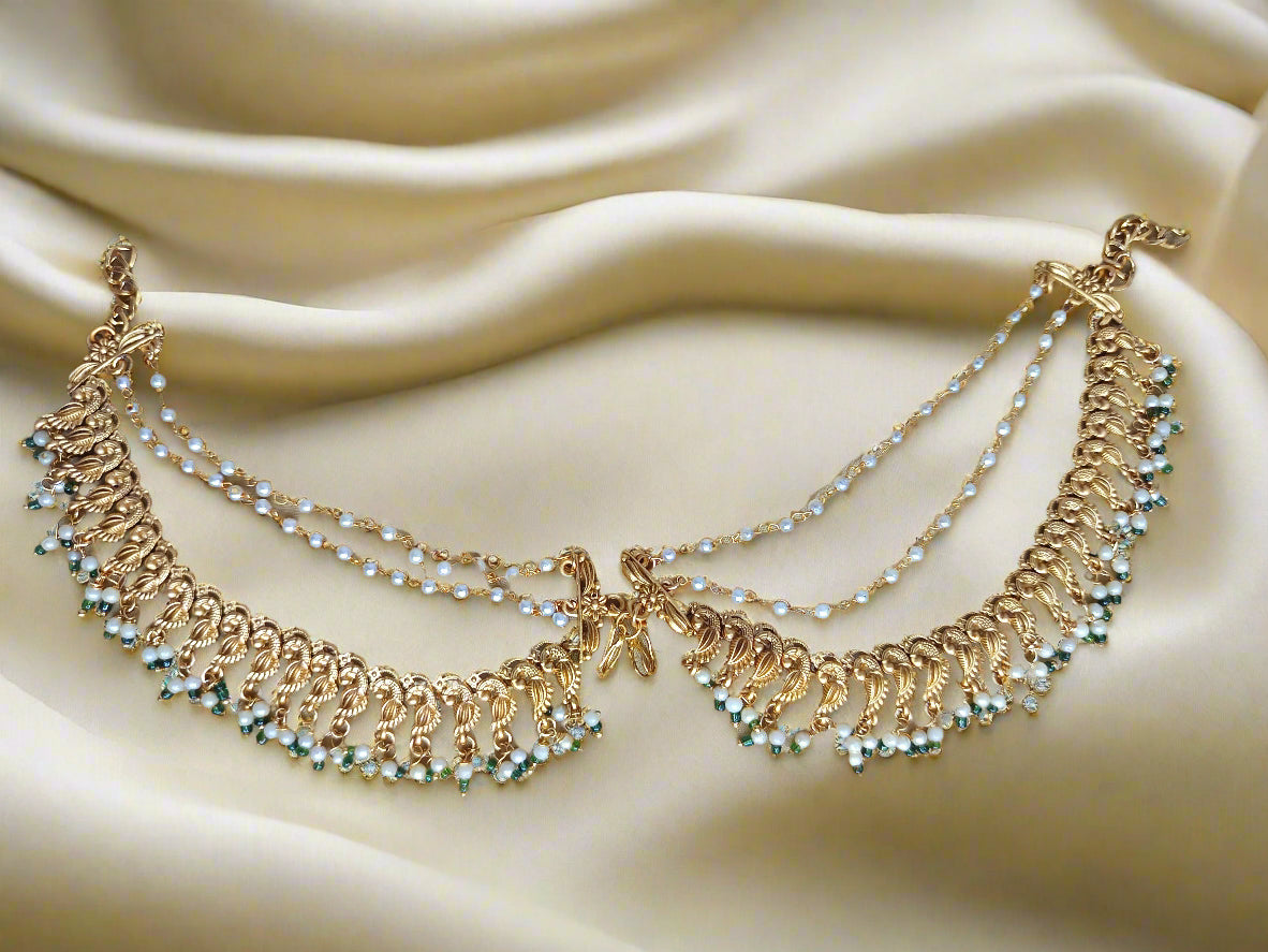 Temple jewelry hair-to-ear chain
Traditional hair-to-ear accessories
South Indian hair-to-ear connectors
Temple design jhumar chain
Antique gold hair-to-ear chain
Bridal hair chain earrings
Hair draping jewelry
Mattal / Maattal (Hair-to-ear chain)
Kemp Stone Hair Chain
Lakshmi Design Ear Chain
Antique Gold Maang Tikka with Ear Chain
Jadau Hair Chain Earrings
Traditional Pearl Maattal
