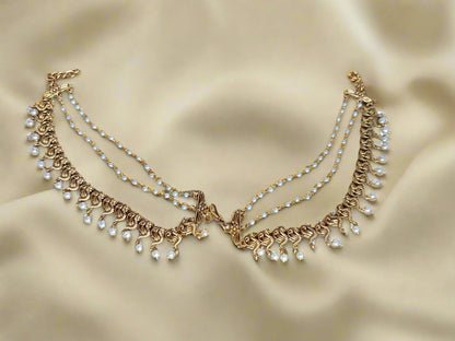 Temple jewelry hair-to-ear chain
Traditional hair-to-ear accessories
South Indian hair-to-ear connectors
Temple design jhumar chain
Antique gold hair-to-ear chain
Bridal hair chain earrings
Hair draping jewelry
Mattal / Maattal (Hair-to-ear chain)
Kemp Stone Hair Chain
Lakshmi Design Ear Chain
Antique Gold Maang Tikka with Ear Chain
Jadau Hair Chain Earrings
Traditional Pearl Maattal
