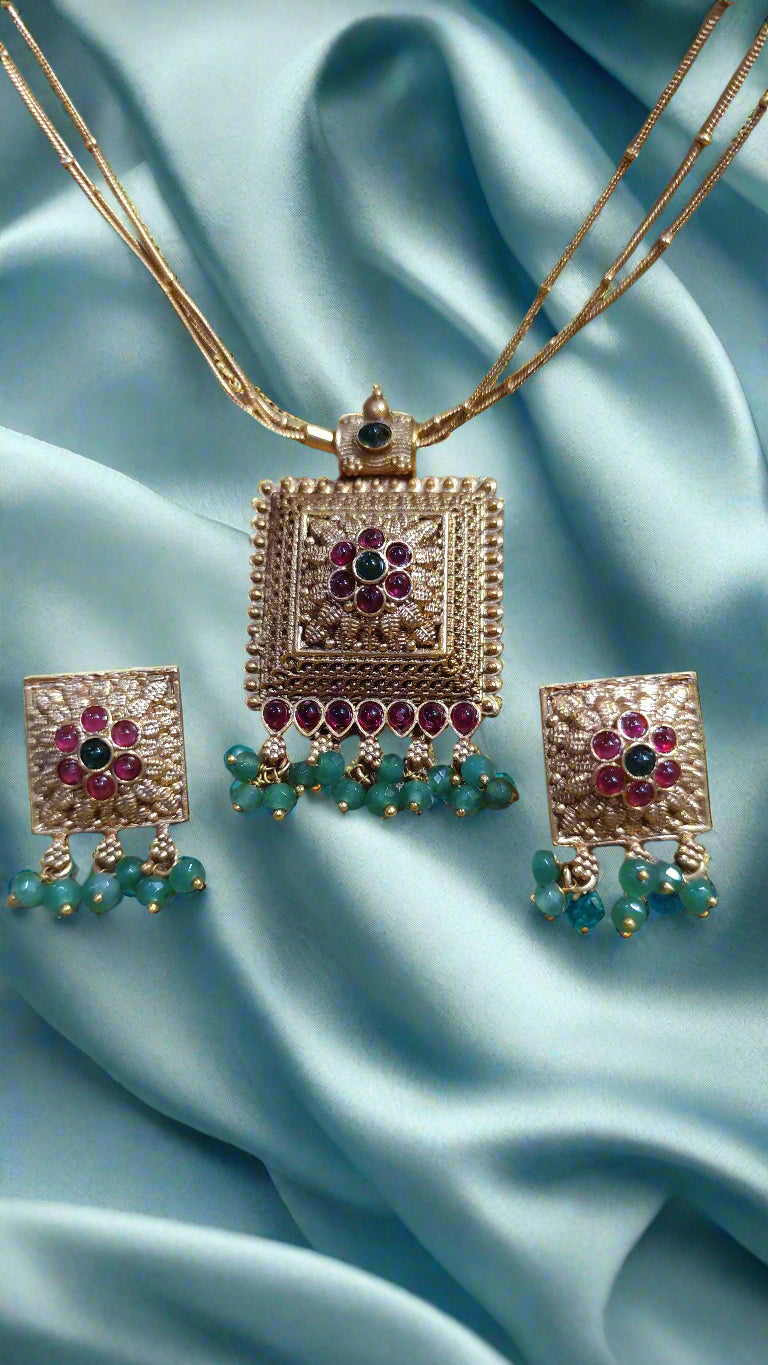 3 layered Gold Chain with pendent and ruby and Emerlad with beads